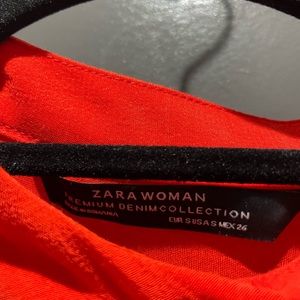 Orange button down dress with middle tie to create waistline